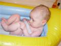 relaxin', takin' a bath in a giant inflatable ducky.